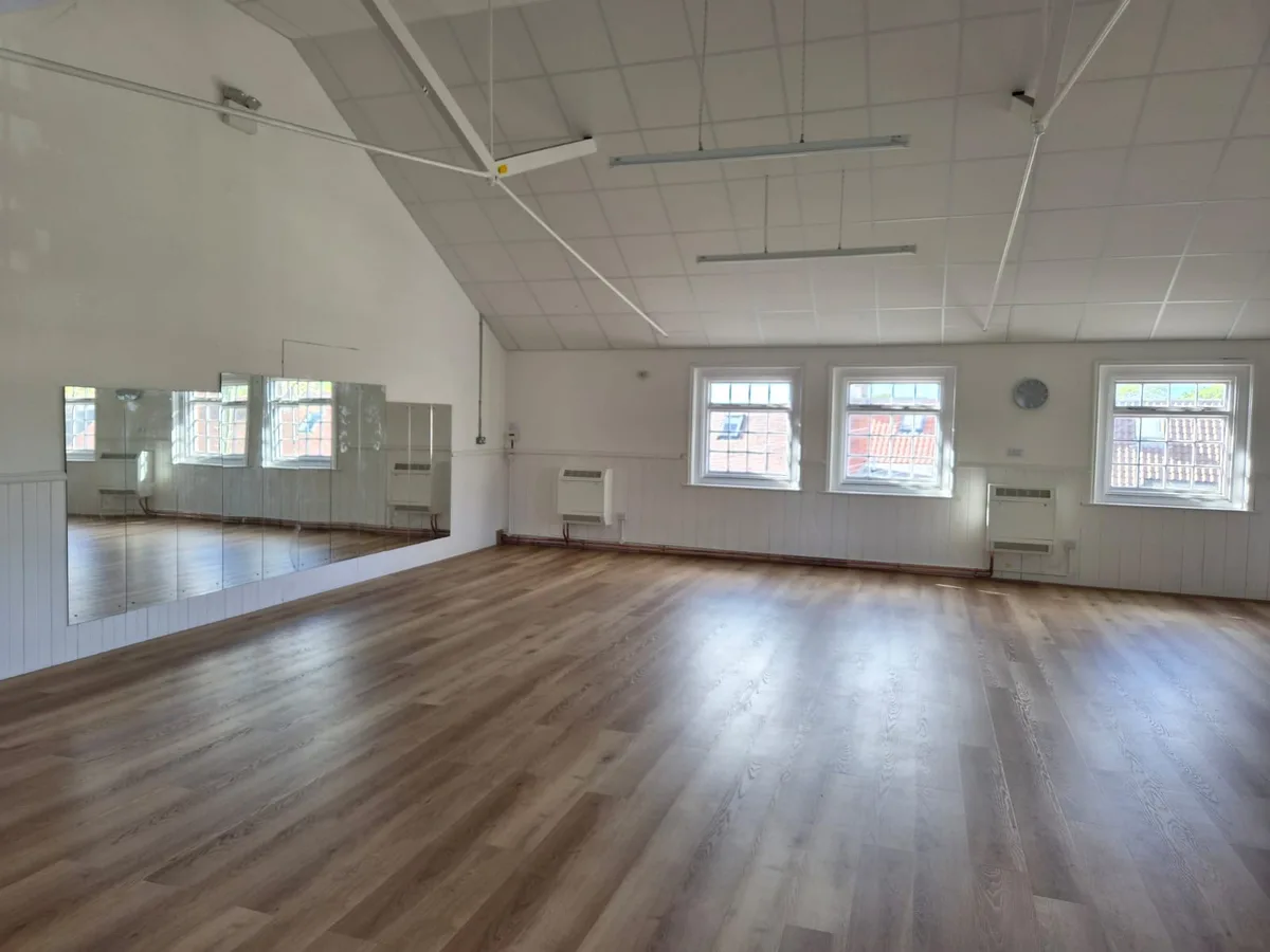 Completed dance studio mirror wall
