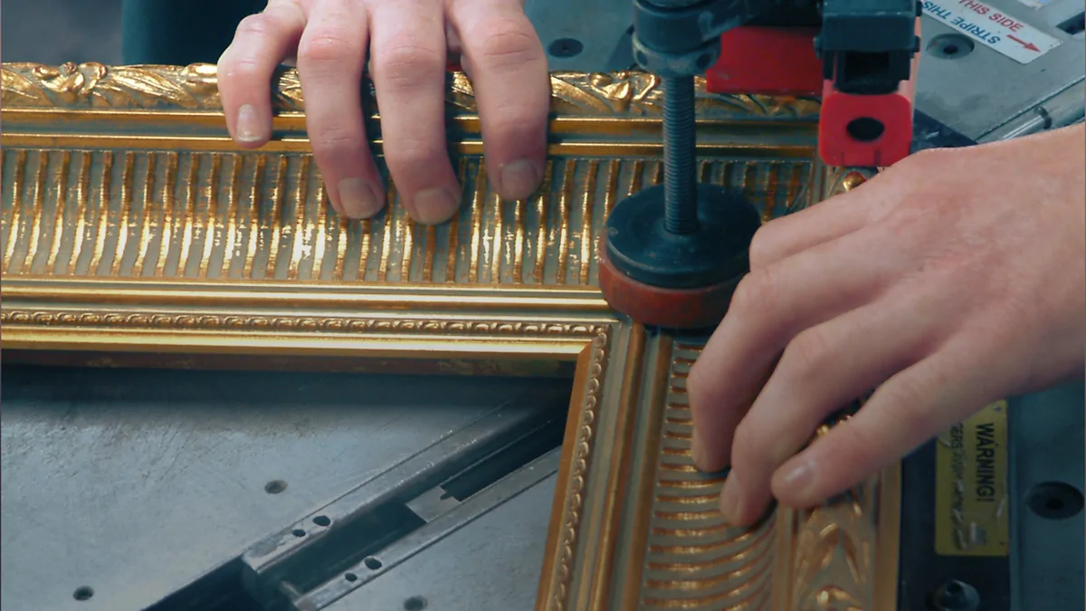 Decorative framed mirror being assembled in a workshop