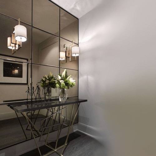 bronze tinted mirror tiles arranged as a decorative feature wall