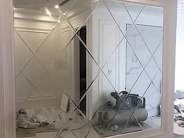 decorative mirror wall feature for a finished interior