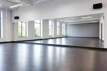 Dance studio wall mirrors across a clean contemporary studio