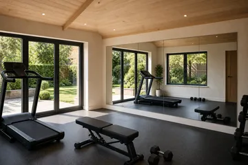 Made-to-measure mirror fitted in a garden room gym