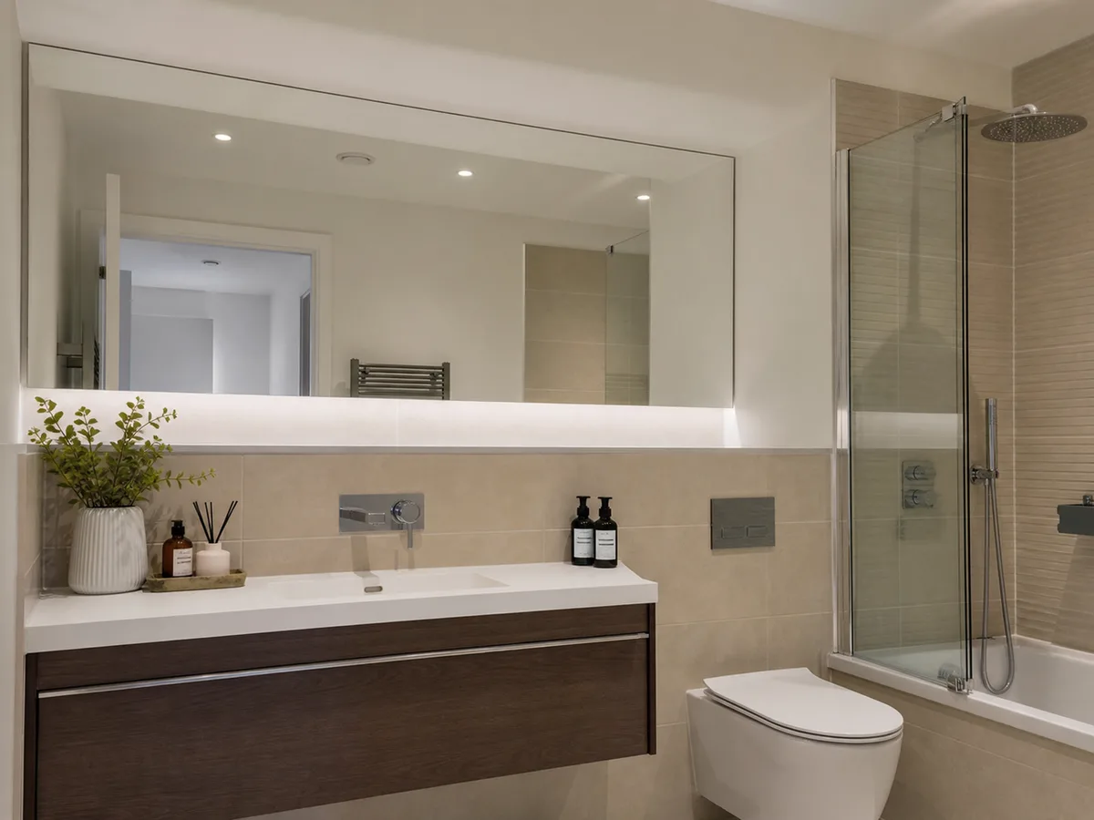 Bathroom mirrors fitted in a modern apartment development