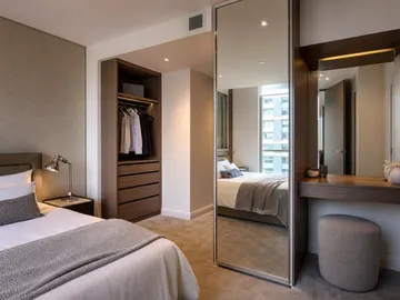 Full-length mirror fitted in a serviced apartment